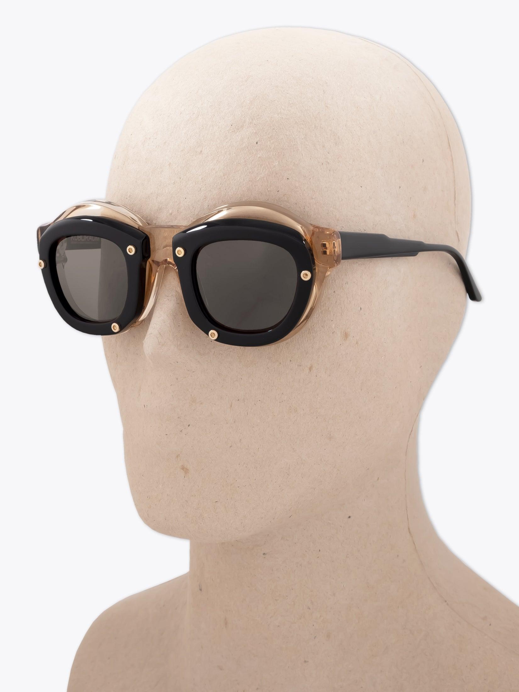 KUBORAUM Mask W1 — Sunglasses — Honey / Black worn on mannequin three-quarter view