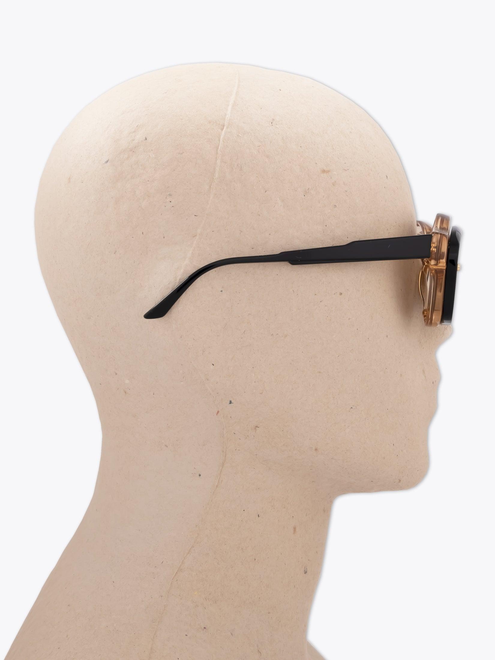 KUBORAUM Mask W1 — Sunglasses — Honey / Black worn on mannequin side view