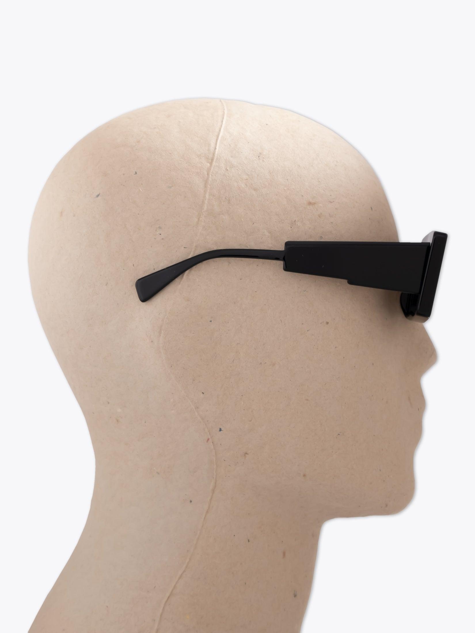 KUBORAUM Mask X11 — Sunglasses — Black worn on mannequin side view