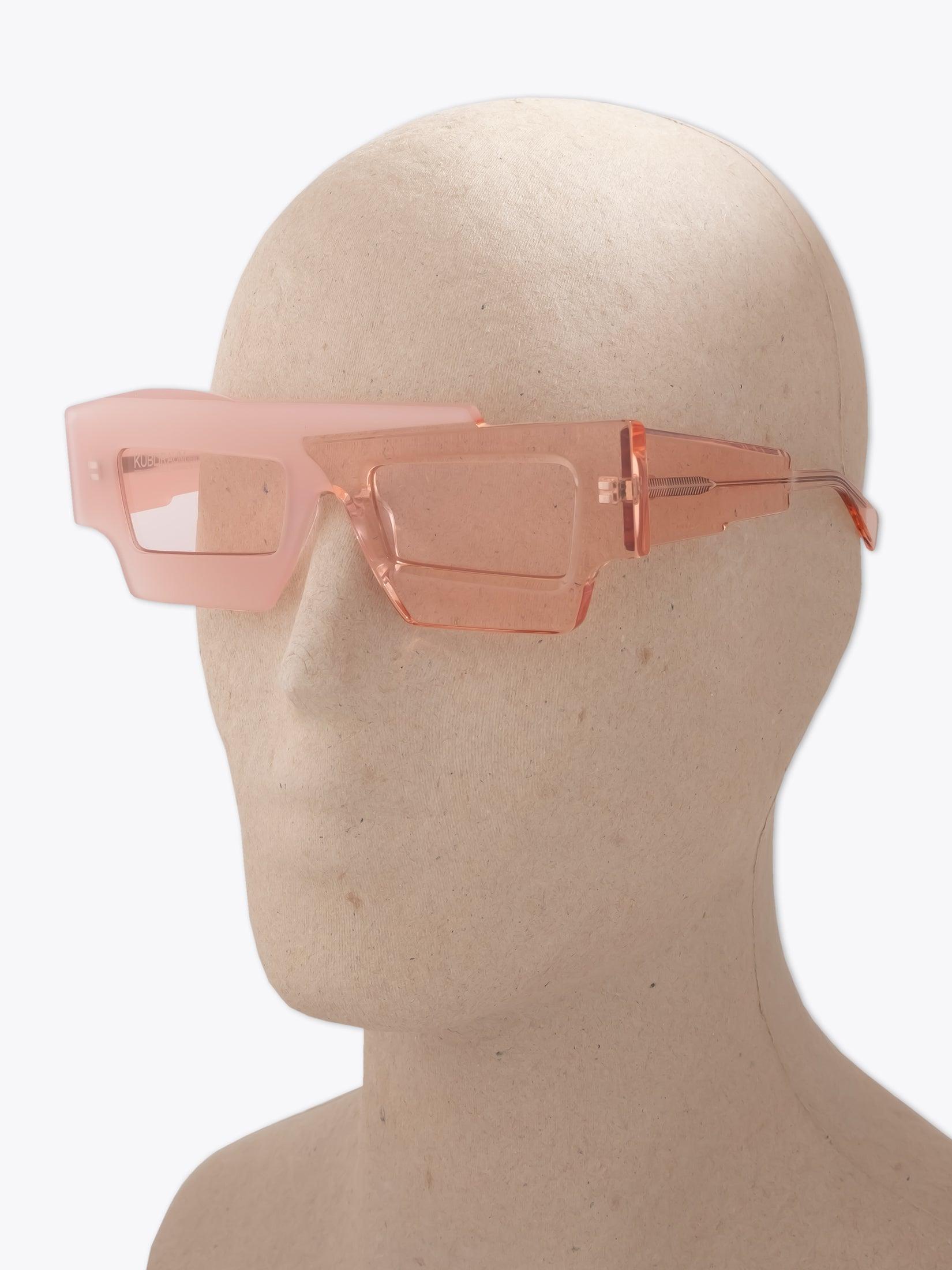 KUBORAUM Mask X12 — Sunglasses — Pink worn on mannequin three-quarter view